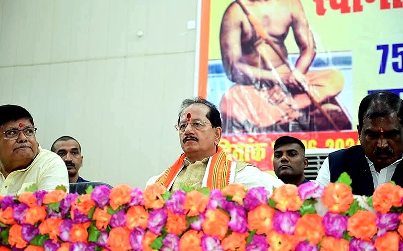 Guests seated at a program dais
