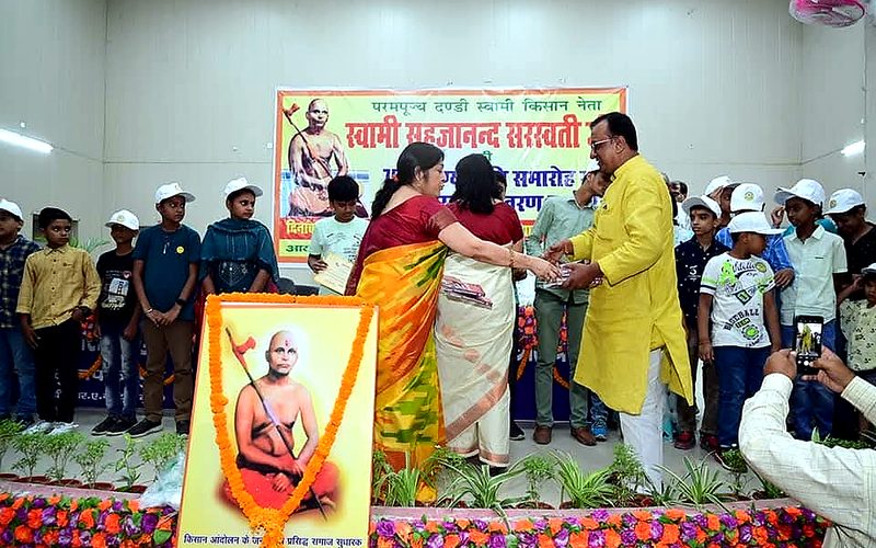 Children receiving recognition on stage